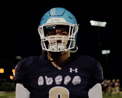 UnitedMasters Amira Unplugged in a bright yellow hat, sequenced yellow top and olive satin skirt